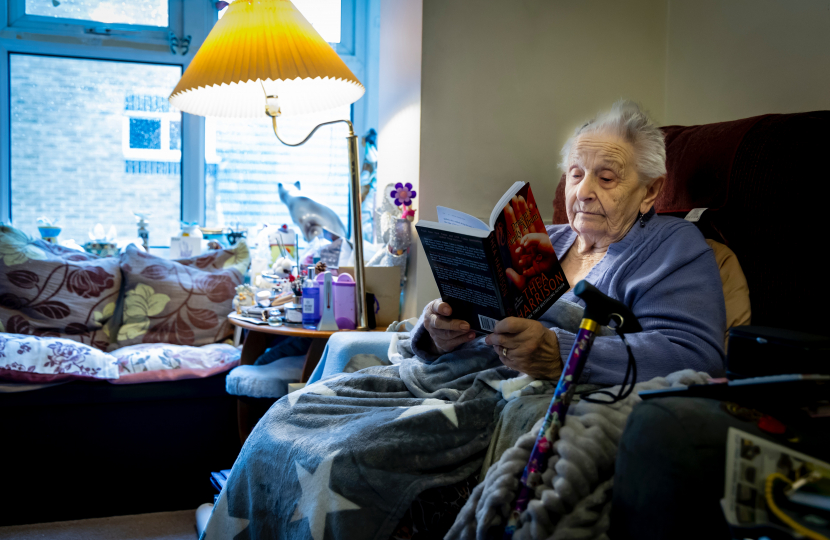 Pensioner keeping warm